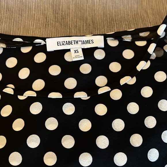 Short-sleeve polka dot navy blouse with sheer strip in middle. - Picture 2 of 3